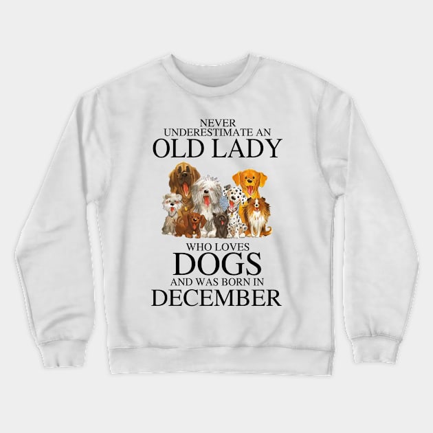 Never Underestimate An Old Lady Who Loves Dogs And Was Born In December Crewneck Sweatshirt by louismcfarland